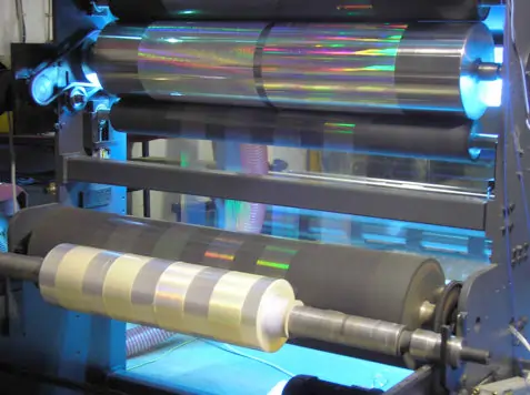 UV embosser for the production of seamless packaging films with holographic elements